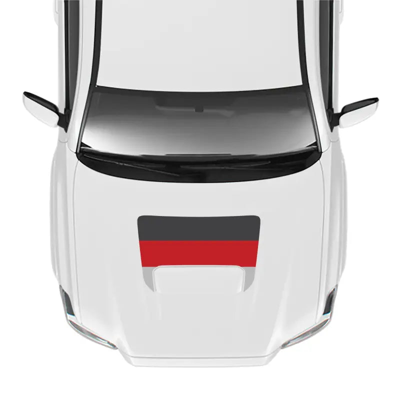 White car with German flag decal showcasing the 2016-23 Tacoma Sport Pro Sport Hood Stamp