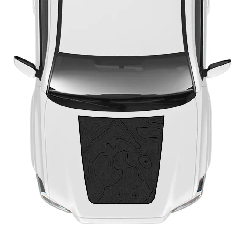 White car with topographic hood decal showcasing the 2016-23 Tacoma Sport Pro Hood Stamp