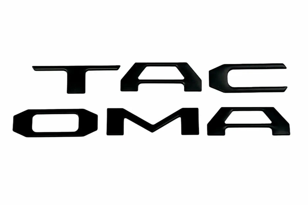Black TACOMA emblem on tailgate inserts for 2016-2023 Tacoma with custom color route protection