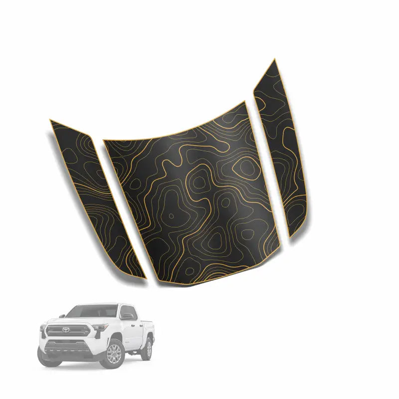 Black and gold topographic hood decal for Tacoma featuring apex hood stamp design