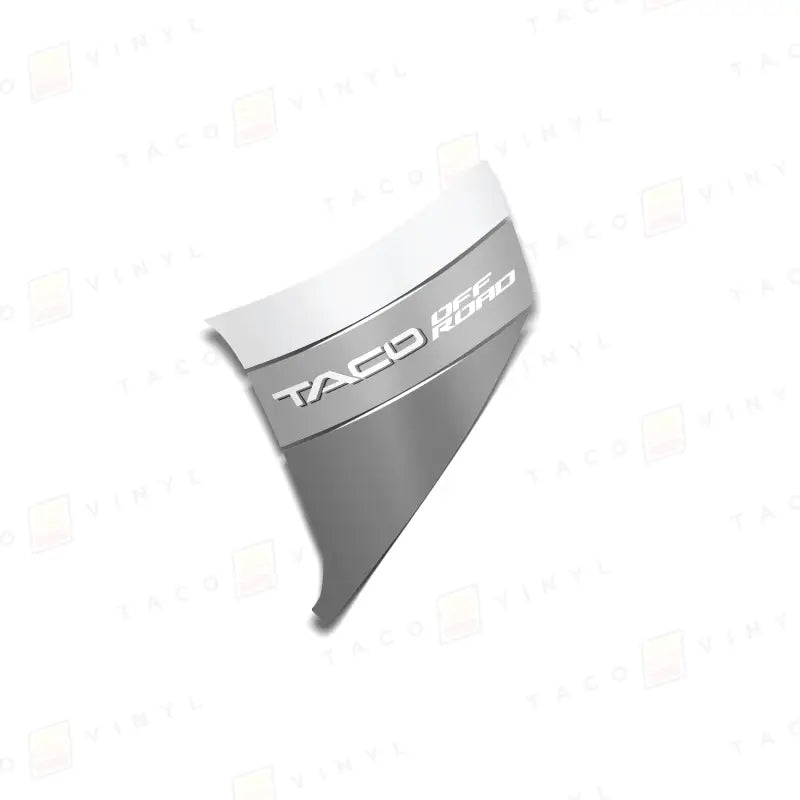 Silver and white TACO OFF ROAD emblem on Tacoma lower bedside decals for 2024+ Tacoma