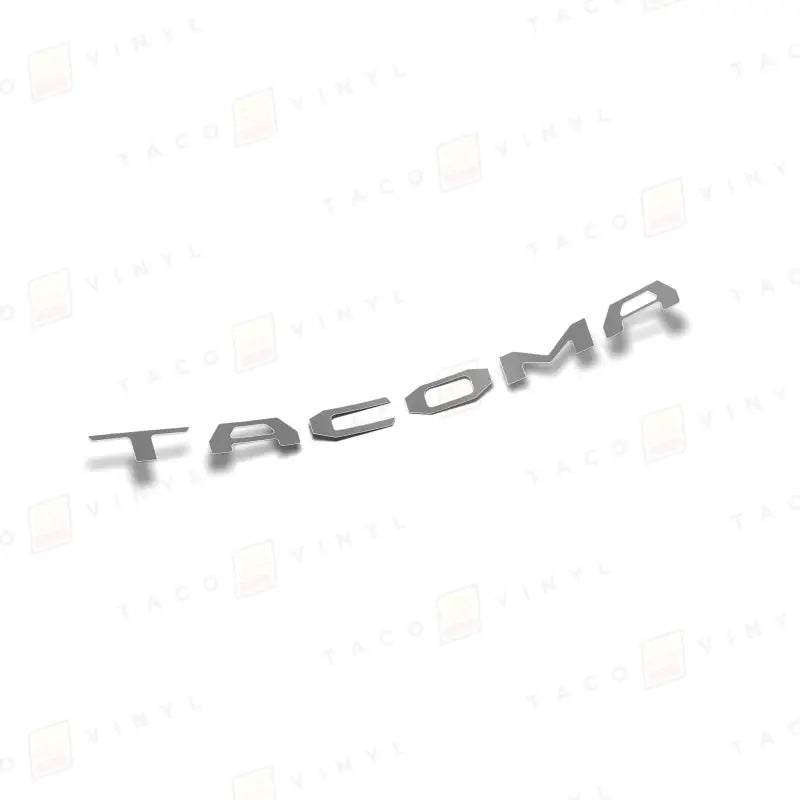 Silver TACOMA lettering on 2024+ Tacoma tailgate with air release vinyl for route protection