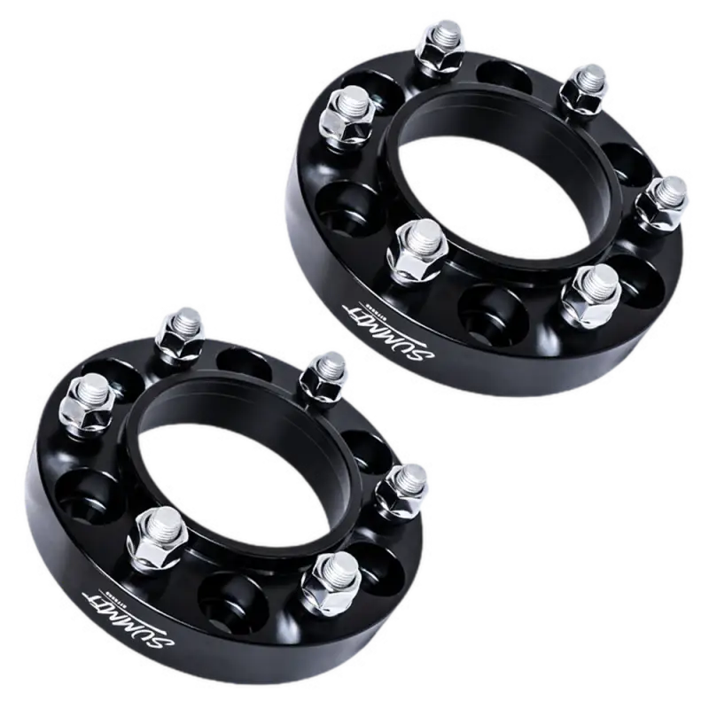 30MM hubcentric wheel spacers with 6x139.7 bolt pattern, black finish, and 12x1.5 studs. Sold in pairs for enhanced vehicle fitment.