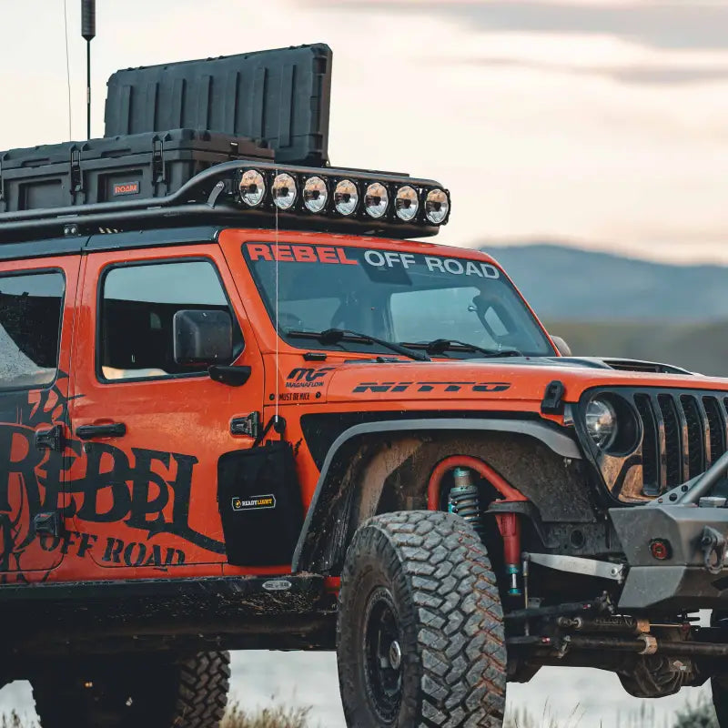 Orange off-road vehicle with the 45-inch Gravity Titan LED Light Bar, designed for superior nighttime visibility.