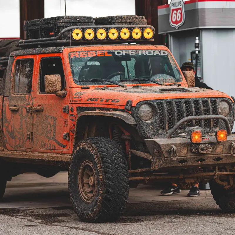 Mud-covered off-road vehicle equipped with the 45-inch Gravity Titan LED Light Bar, showcasing its rugged performance.