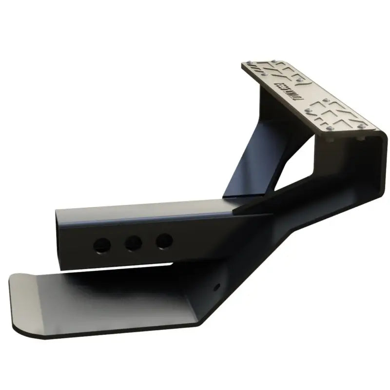 Angled view of the 4CX Boar Hitch Step, showcasing its robust carbon steel frame and hitch-mounted design for easy installation and bumper protection.