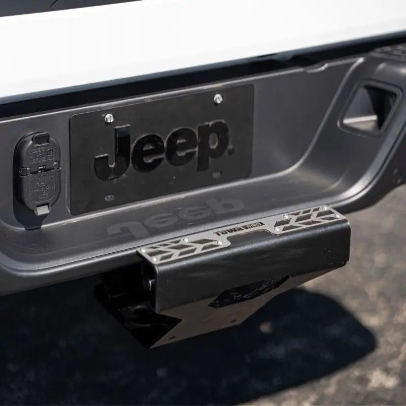 4CX Boar Hitch Step installed on a Jeep, showcasing its sturdy carbon steel construction and easy hitch-mounted design for enhanced functionality.