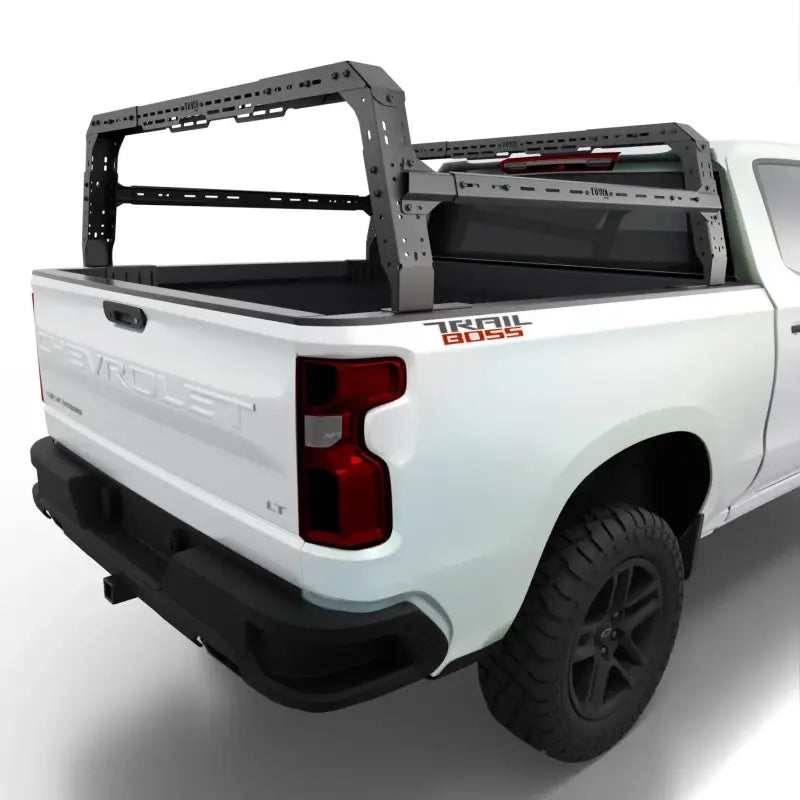 GMC Sierra 4CX adjustable bed rack installed on a white truck, enhancing cargo space for overlanding and RTT compatibility.
