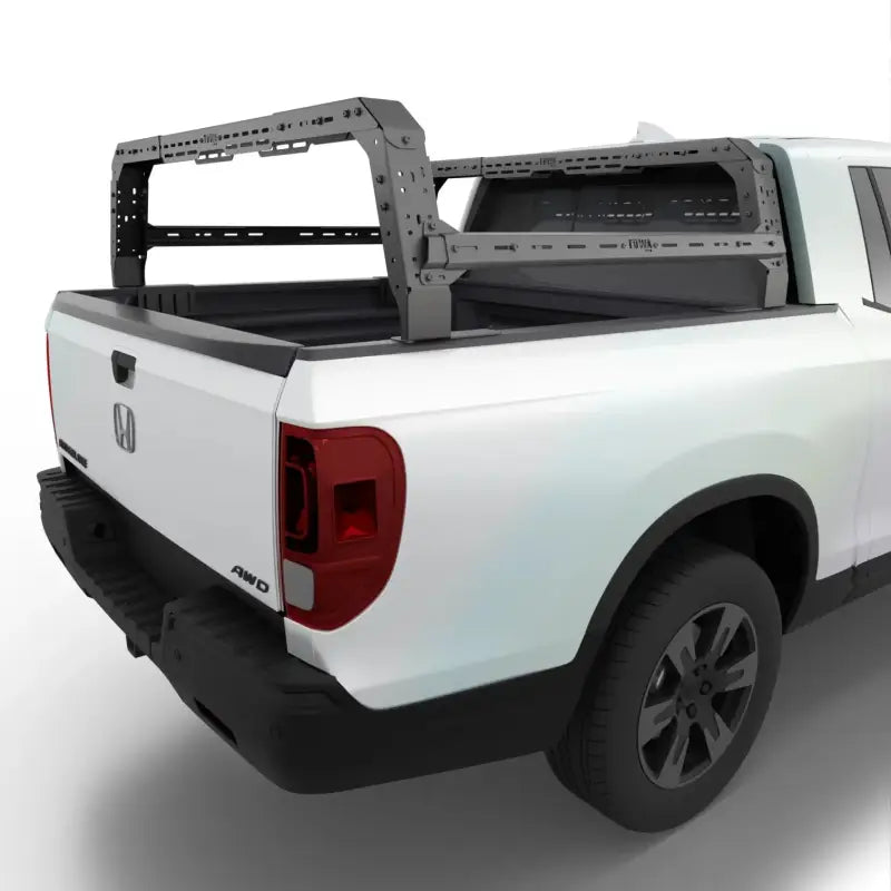 Honda Ridgeline bed rack with adjustable height and modular design installed on a white truck. Ideal for overlanding and cargo management.