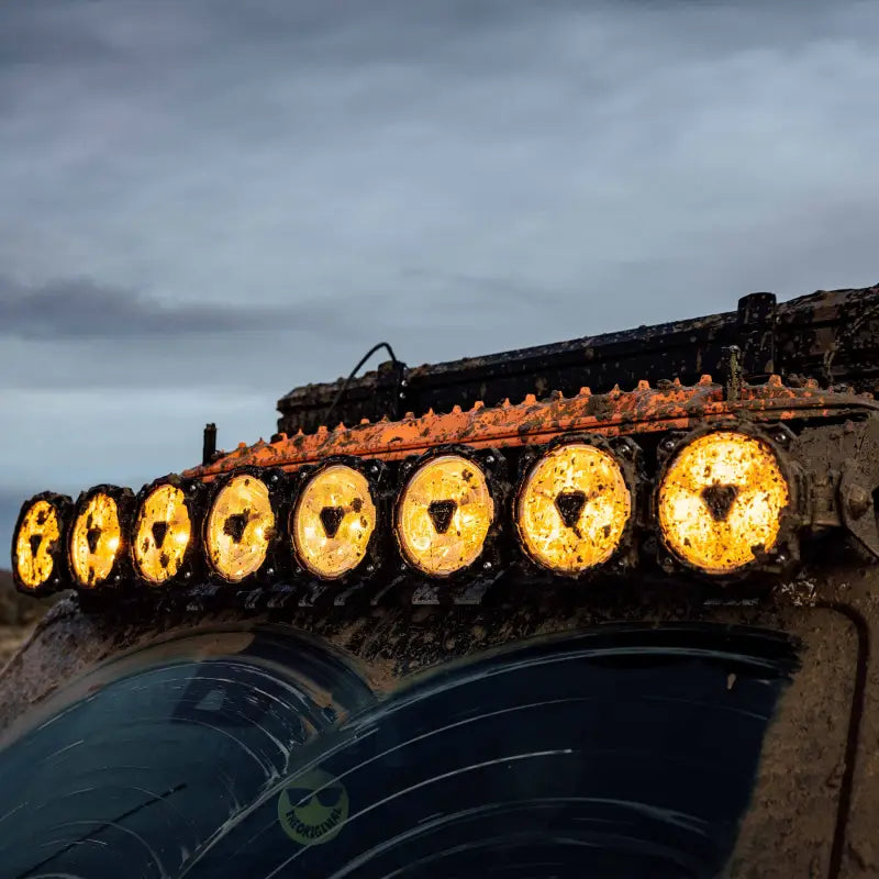 Mud-covered 50-inch Gravity Titan LED Light Bar on a vehicle, demonstrating its resilience in harsh off-road conditions.