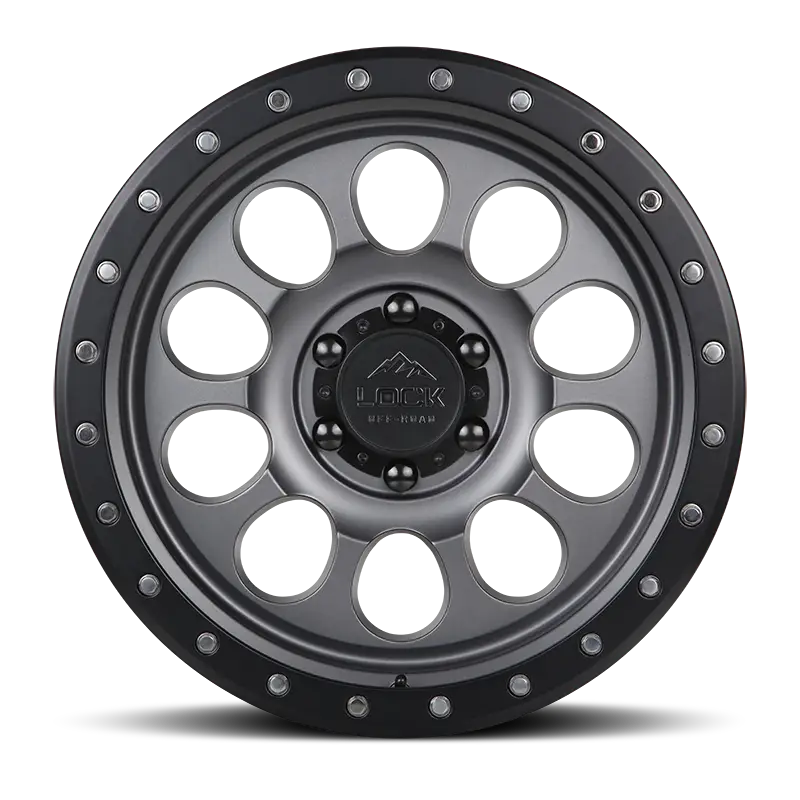 Front view of the 50CAL Matte Grey wheel showcasing its unique revolver pattern, matte finish, and rugged beadlock-inspired rim design.