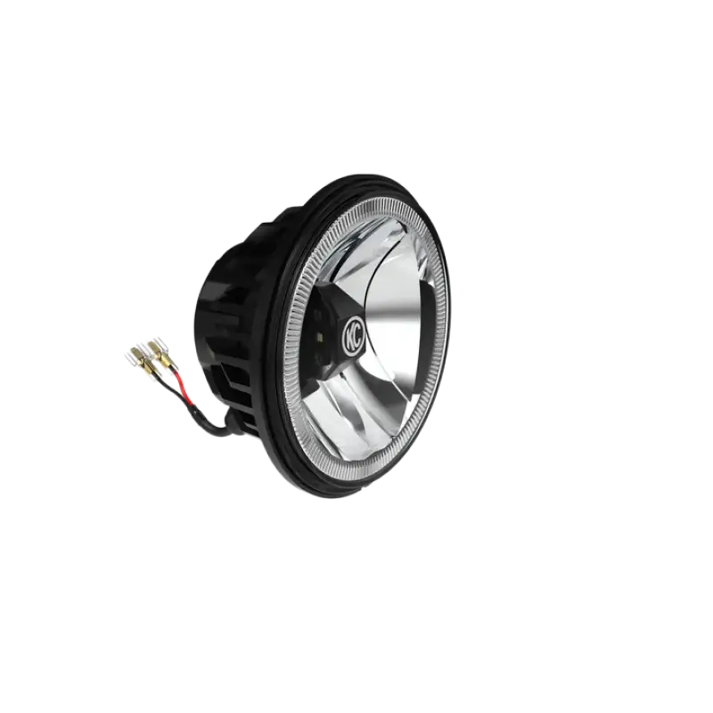 Angled view of 6-inch Gravity® LED G6 driving beam light with reflective lens and KC logo, designed for off-road and street use.