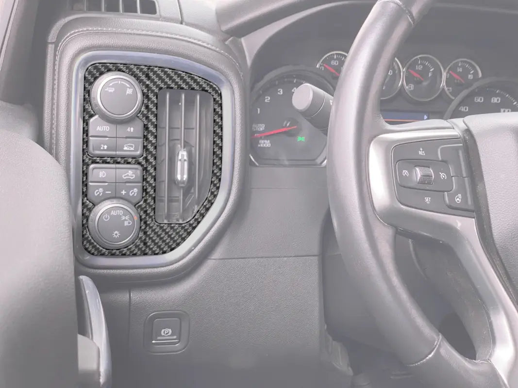 Carbon fiber dashboard trim for headlight control accent overlays in Chevrolet Silverado