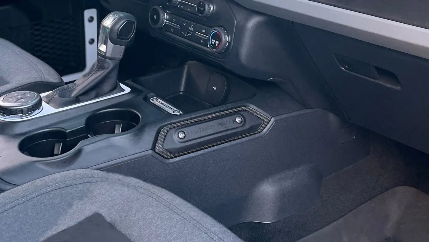 Car’s center console with accessory accent overlay for 2021-2024 Ford Bronco