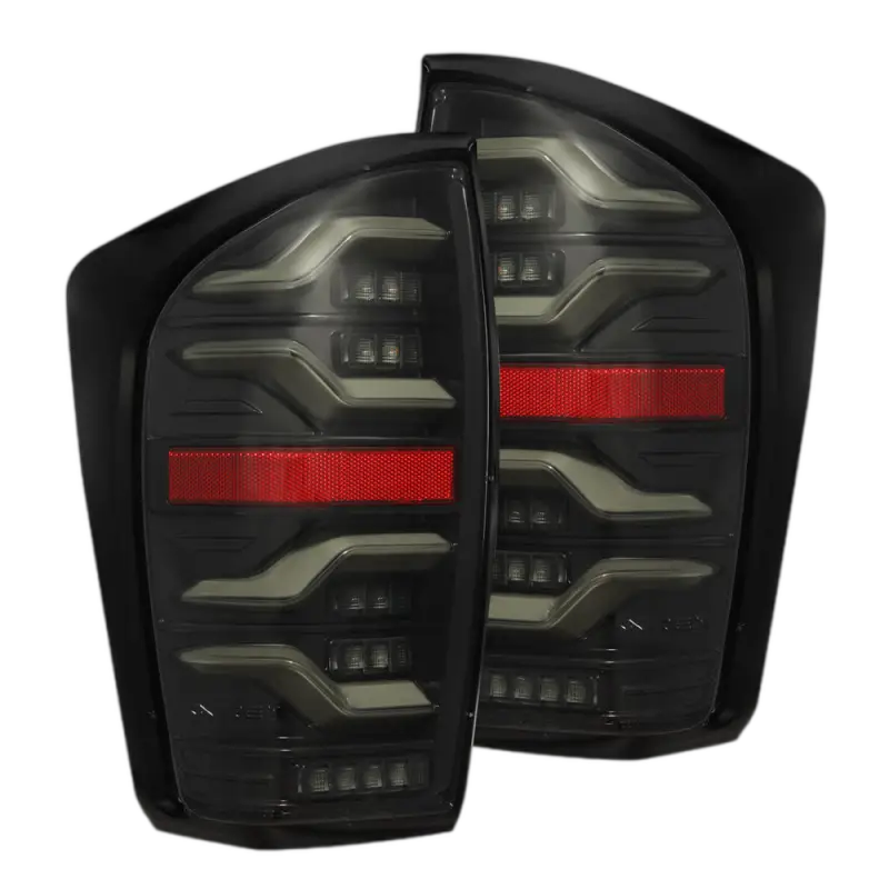 Toyota Tacoma LUXX-Series LED tail lights with black housing and red accents, designed for 2016-2023 models. Features sequential turn signals.