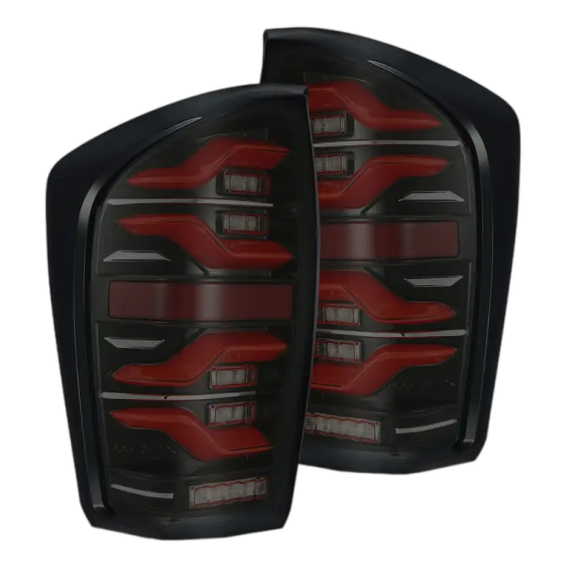 Toyota Tacoma LUXX-Series LED tail lights with bold red accents and black housing, tailored for 2016-2023 models. Durable and stylish upgrade.