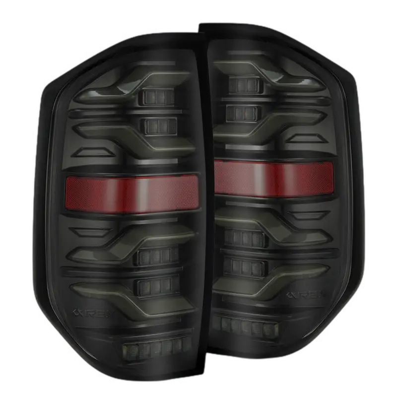 AlphaRex LUXX-Series LED tail lights for Toyota Tundra 2014-2021 in a sleek black housing with red accents, enhancing visibility and style.