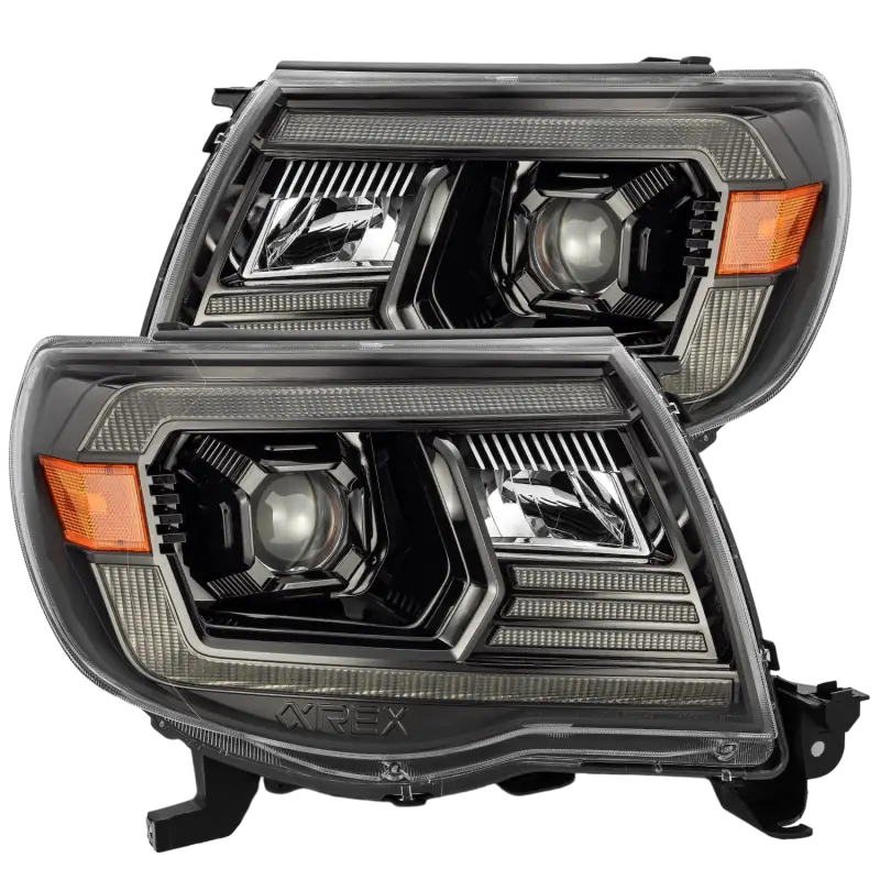 AlphaRex LUXX-Series projector headlights for 2005-2011 Toyota Tacoma in black housing with amber accents, enhancing visibility and style.