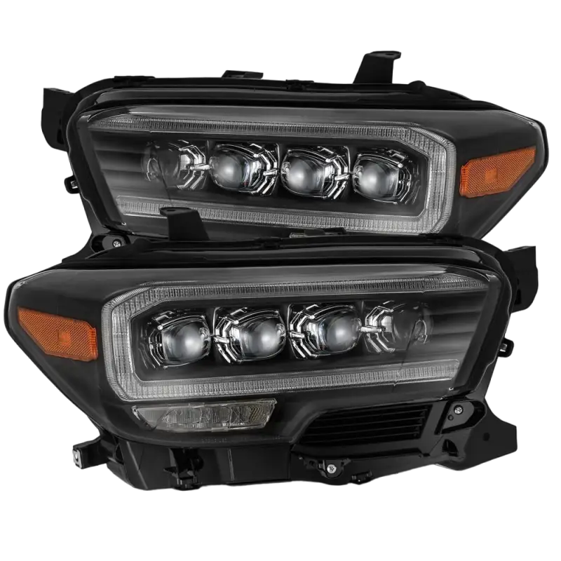 AlphaRex NOVA-Series LED projector headlights for Toyota Tacoma (2016-2023) in black housing with quad LED projectors and clear accents.