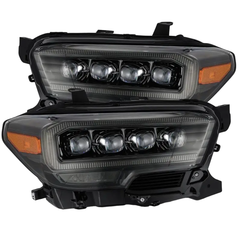 AlphaRex NOVA-Series LED projector headlights for Toyota Tacoma (2016-2023) in black housing with quad LED projectors and amber accents.