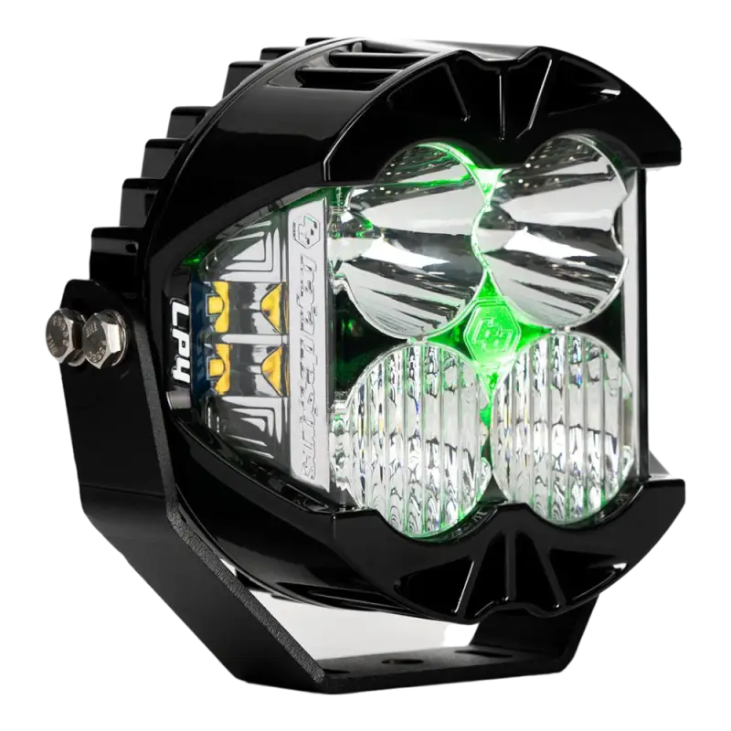 Baja Designs LP4 LED Pod Light featuring green backlight, clear lens, compact design, and advanced cooling for off-road applications.