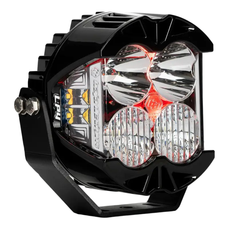 Baja Designs LP4 LED Pod Light featuring red backlight, clear lens, compact design, and advanced cooling for off-road applications.