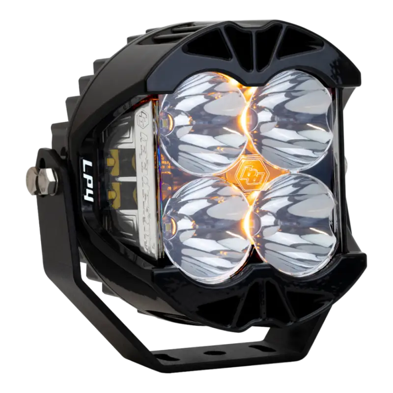 Baja Designs LP4 LED Pod Light with clear lens, compact design, and customizable amber backlight for off-road vehicles.
