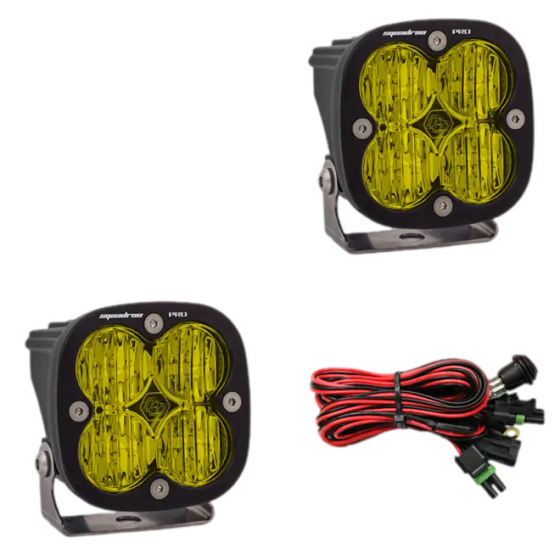 Baja Designs Squadron Pro LED light pods in black housing with amber lenses, offering high-performance lighting and wiring harness.