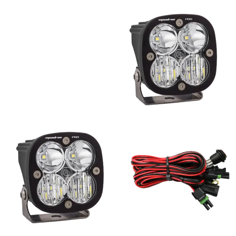 Baja Designs Squadron Pro LED light pods in black housing with clear lenses, featuring 4,600 lumens and wiring harness.