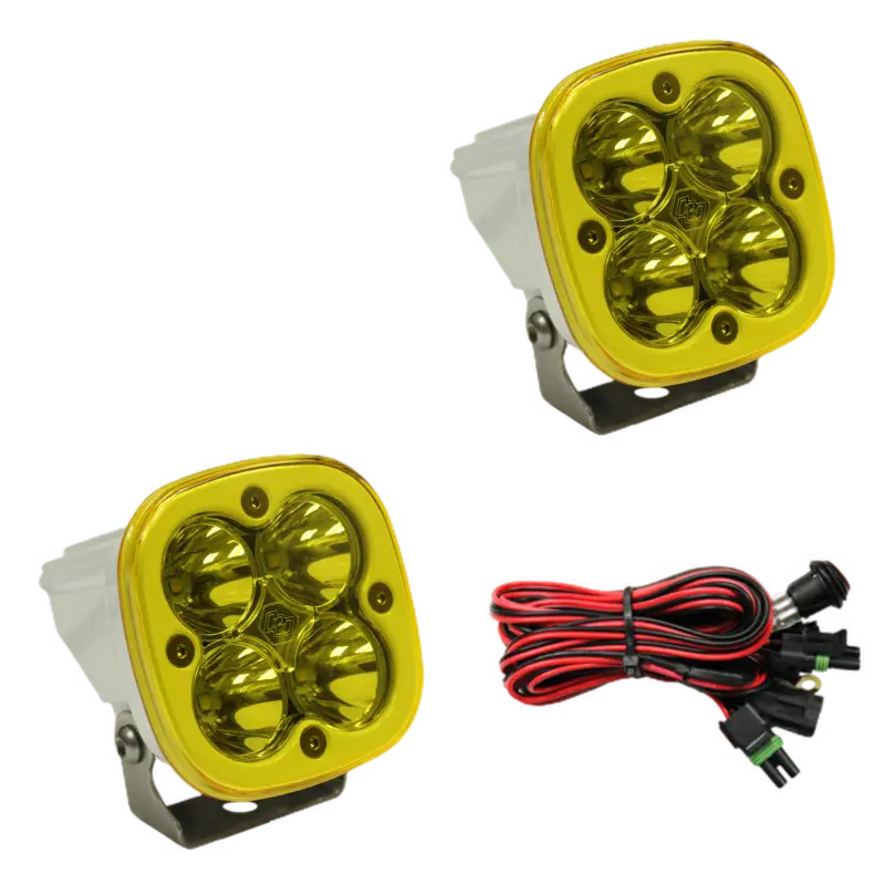 Baja Designs Squadron Pro LED light pods in white housing with amber lenses, delivering waterproof design and wiring harness.