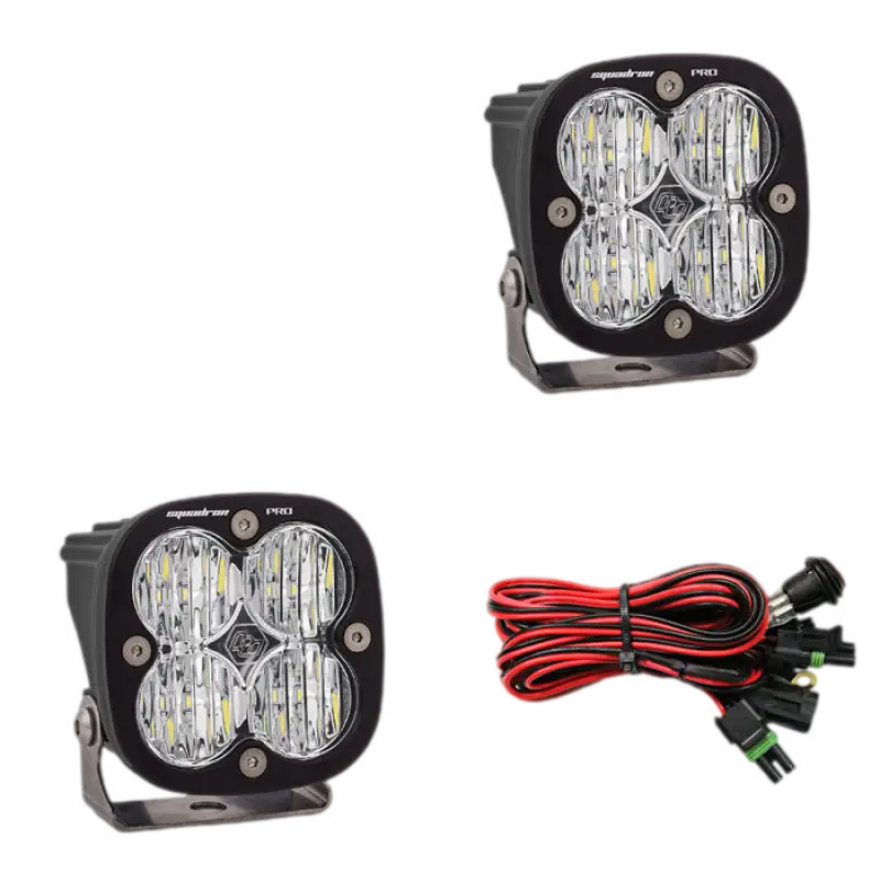 Baja Designs Squadron Pro LED light pods in black housing with clear lenses, featuring waterproof design and included wiring harness.