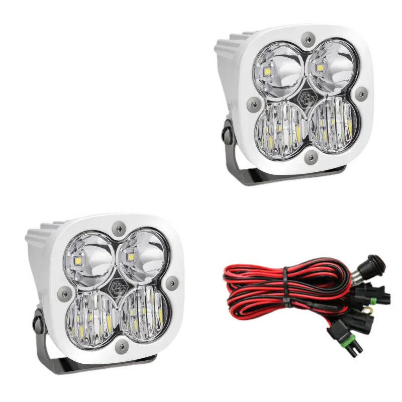White bezel Baja Designs Squadron Sport Pro LED off-road lights with wiring harness