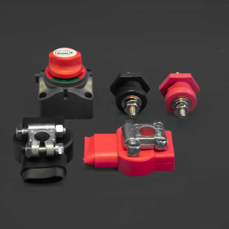 Close-up of battery terminals, clamps, and switch from the Toyota Tacoma battery relocate kit by JETG Designs.