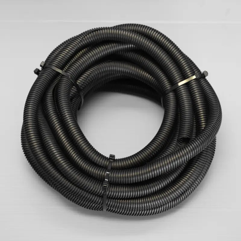Flexible black corrugated tubing included in the Toyota Tacoma battery relocate kit for wire protection and organization.