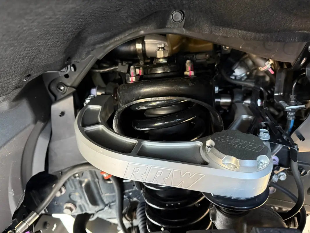 Silver suspension component with black spring for Colorado ZR2, kevlar reinforced and FEA analyzed