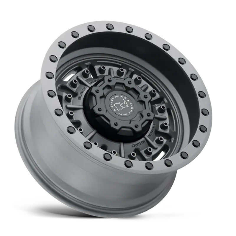 Matte gunmetal gray Black Rhino Abrams wheel with a bold multi-spoke design and beadlock-style detailing for off-road vehicles.