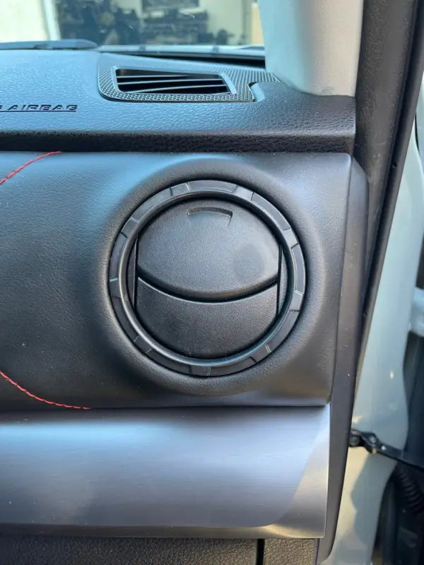 Close-up of a Tundra Blackout Vent Ring installed on a dashboard, blending seamlessly with the interior.