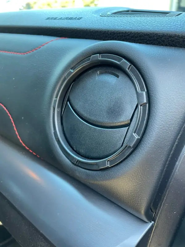 Installed Tundra Blackout Vent Ring on a vehicle dashboard, enhancing the interior with a modern blackout design.