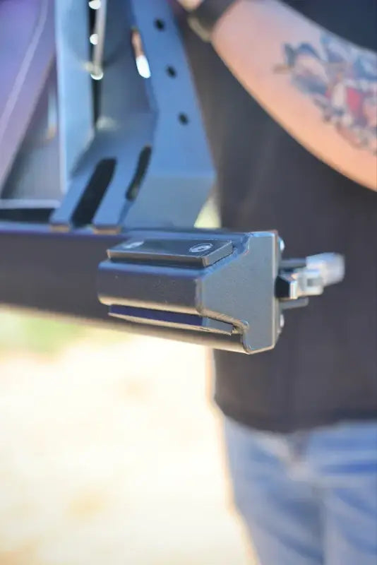 Close-up of the locking mechanism on the Tacoma bolt-on swing out, ensuring secure attachment and ease of use.