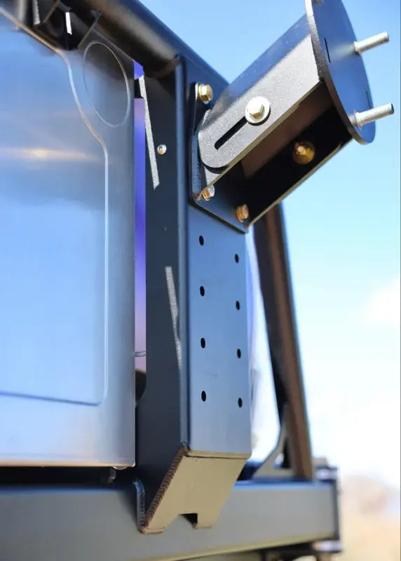 Detailed view of the Tacoma bolt-on swing out hinge mechanism, highlighting heavy-duty construction and adjustable mounting.