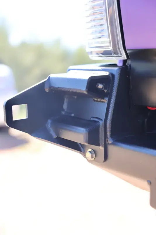 Mounting bracket of the Tacoma bolt-on swing out, designed for secure attachment to the DRT bumper system.