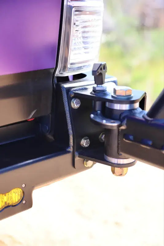Close-up of the Tacoma bolt-on swing out hinge, emphasizing its durable construction and secure mounting capabilities.