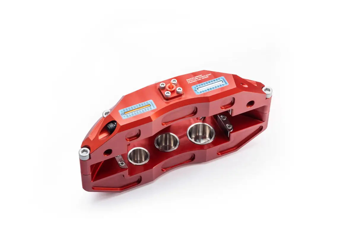 Angled view of red PowerBrake caliper with specifications and pistons, included in 4Runner Big Brake Kit 03-09.