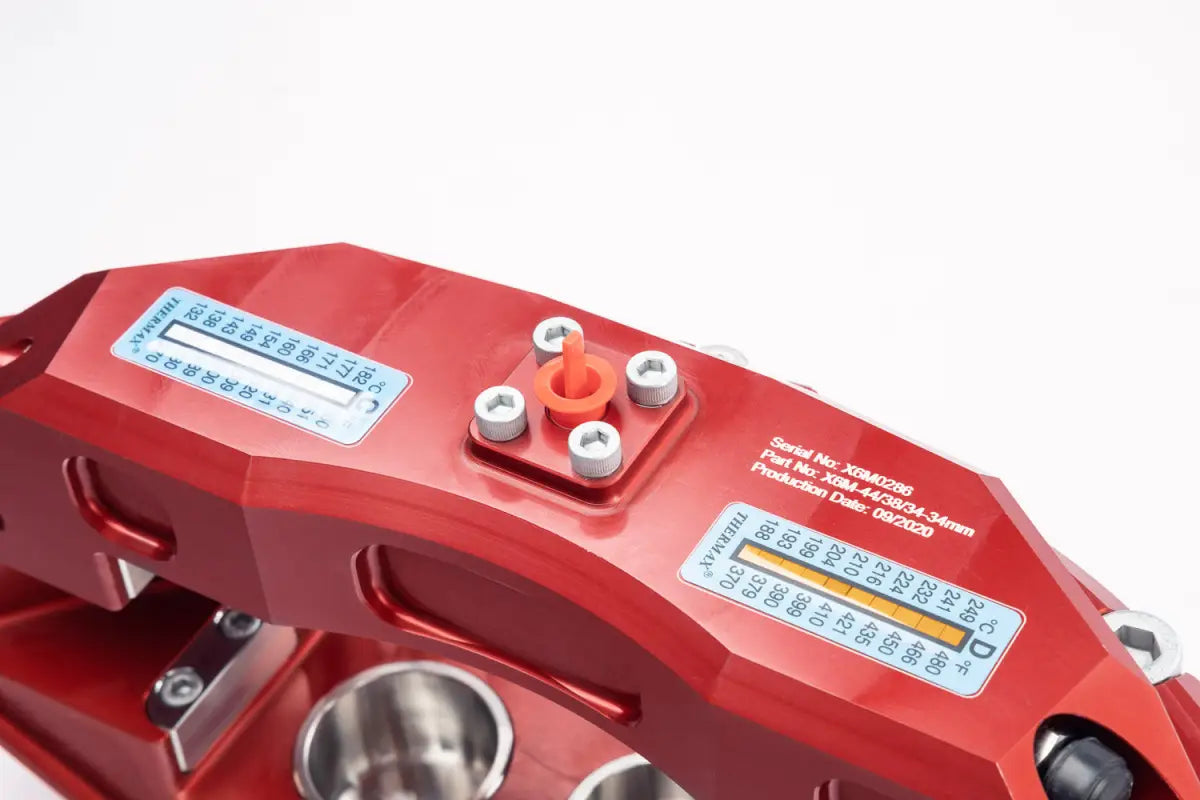 Top view of red PowerBrake caliper with serial number and specifications, part of the 4Runner Big Brake Kit 03-09.