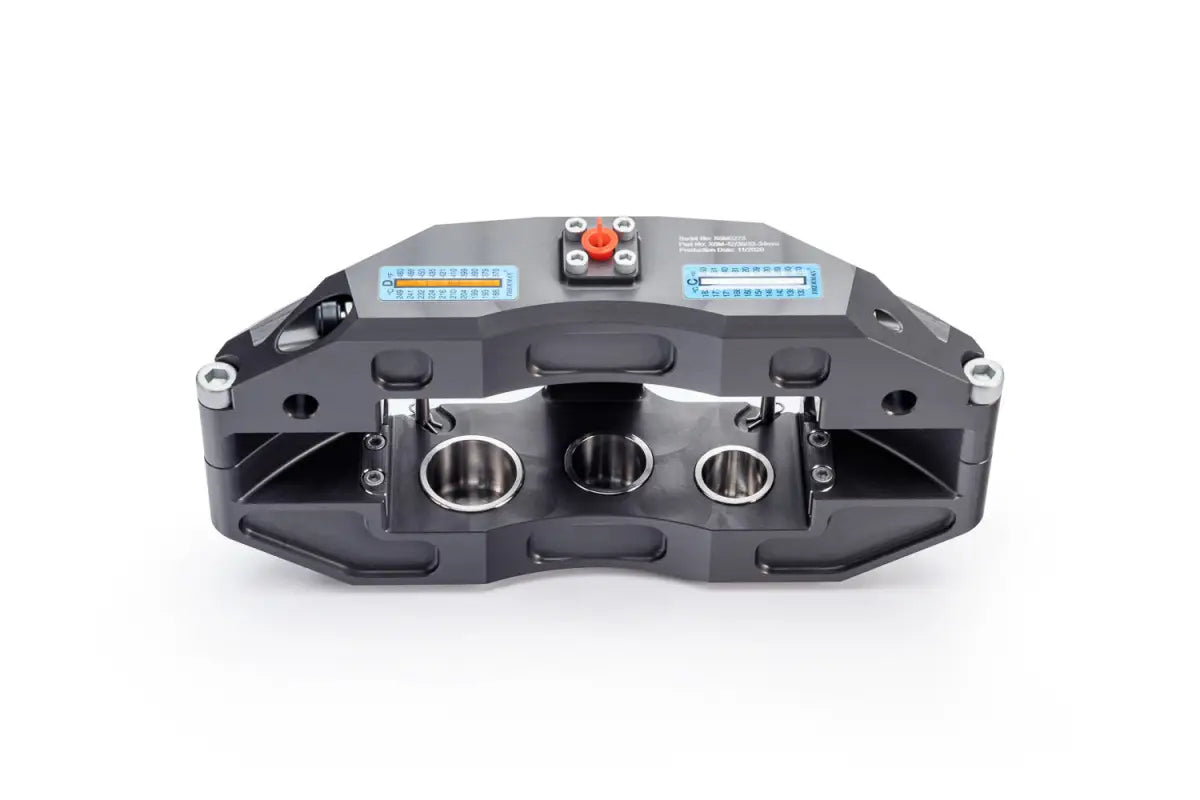 Front view of the PowerBrake 6 piston caliper, emphasizing its stainless steel pistons and technical specifications.