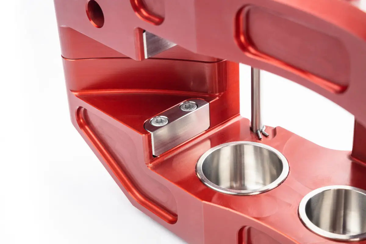 Detailed view of the red PowerBrake 6-piston caliper's internal components, highlighting its robust design and materials.