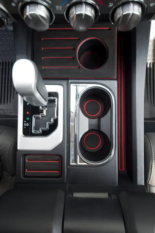 Close-up of bucket seat foam inserts for 2014-2021 Toyota Tundra, highlighting the red accents and precise fit in the center console.