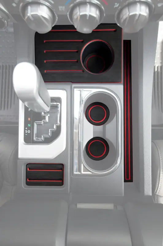 Bucket seat foam inserts for 2014-2021 Toyota Tundra, installed in the center console, featuring a sleek black and red design.