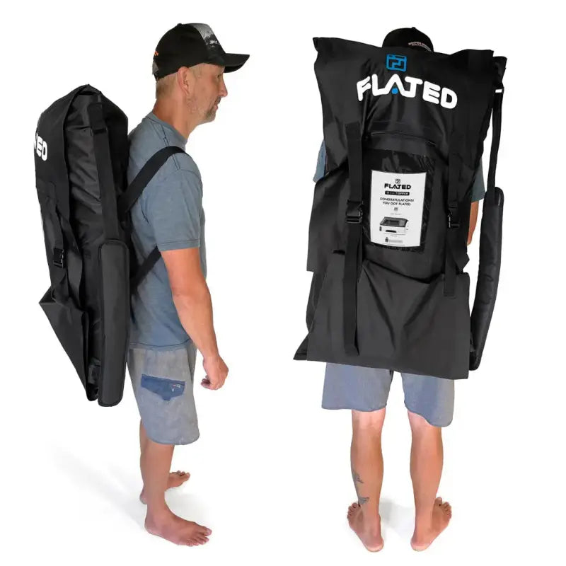 Person carrying the Flated Air-Topper kit bag as a backpack, showcasing its portability and compact storage design.