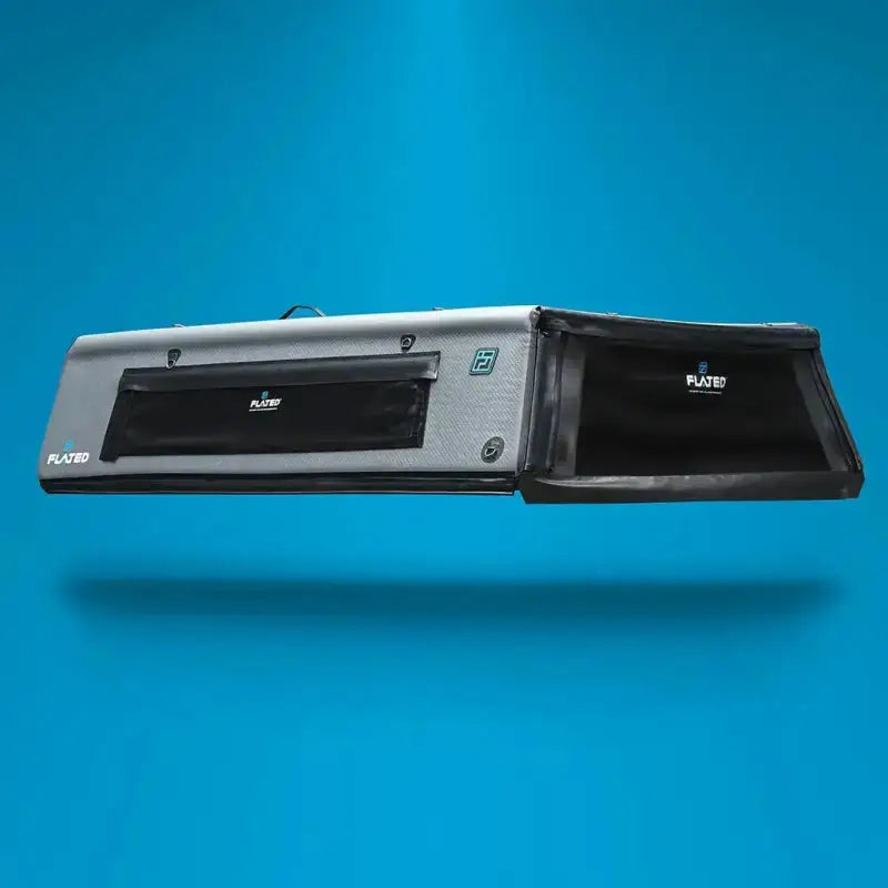 CAP Mid-Size 5' Bed Air-Topper floating against a blue background, highlighting its lightweight and compact design.